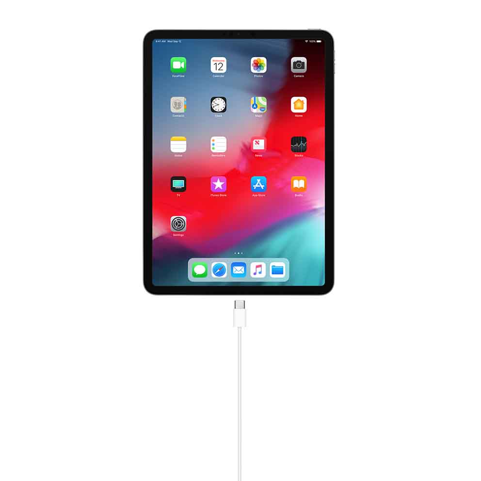 Apple USB-C Charge Cable in white with USB-C connectors on both ends connected to a black tablet device.