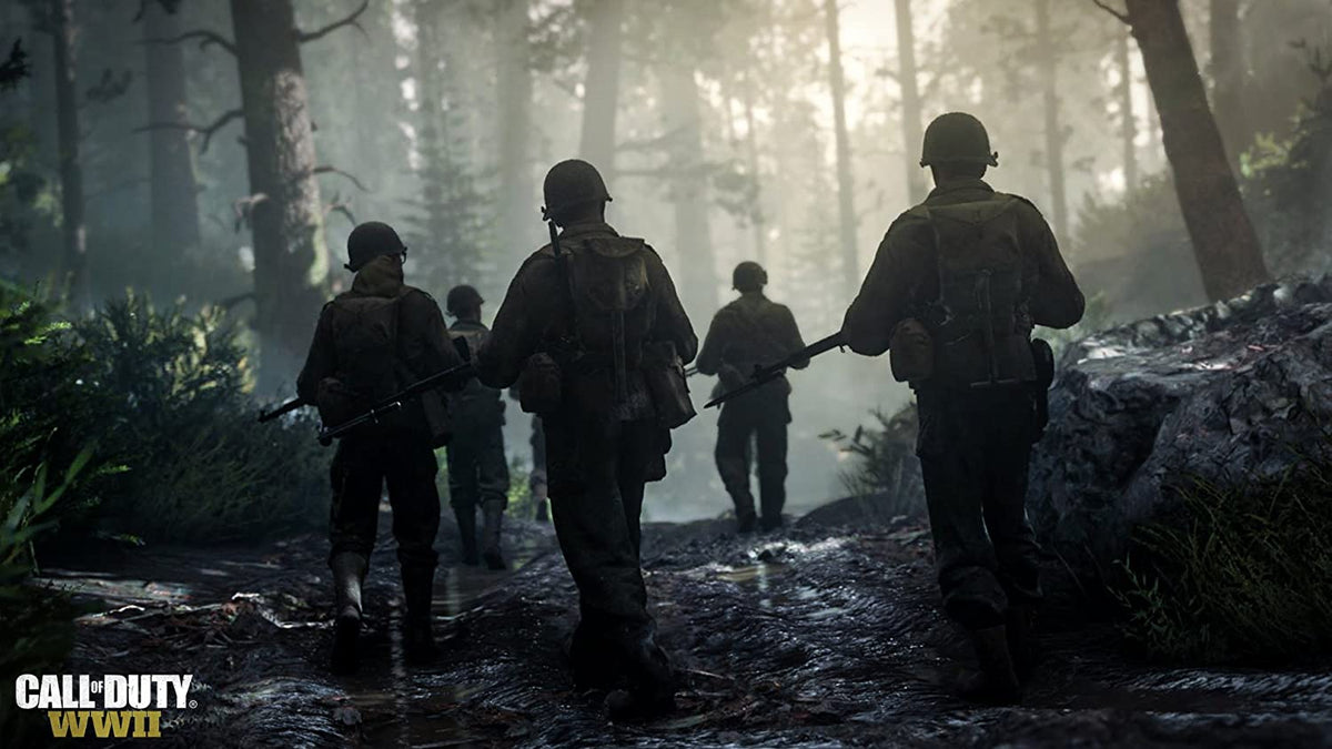 Call of Duty WWII scene with five soldiers in dark green military uniforms and helmets walking through a misty forest path.