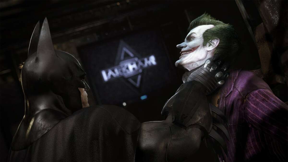 Batman Arkham Collection showing Batman in black armored suit gripping the Joker in a purple pinstripe suit with green hair and white face paint.