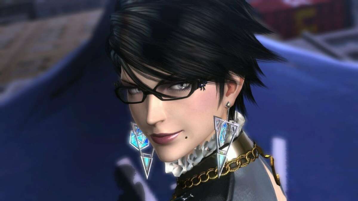 Bayonetta character with black hair, glasses, and geometric blue and silver earrings, featuring a ruffled white collar and gold chain, promoting Bayonetta 2 Game Card.
