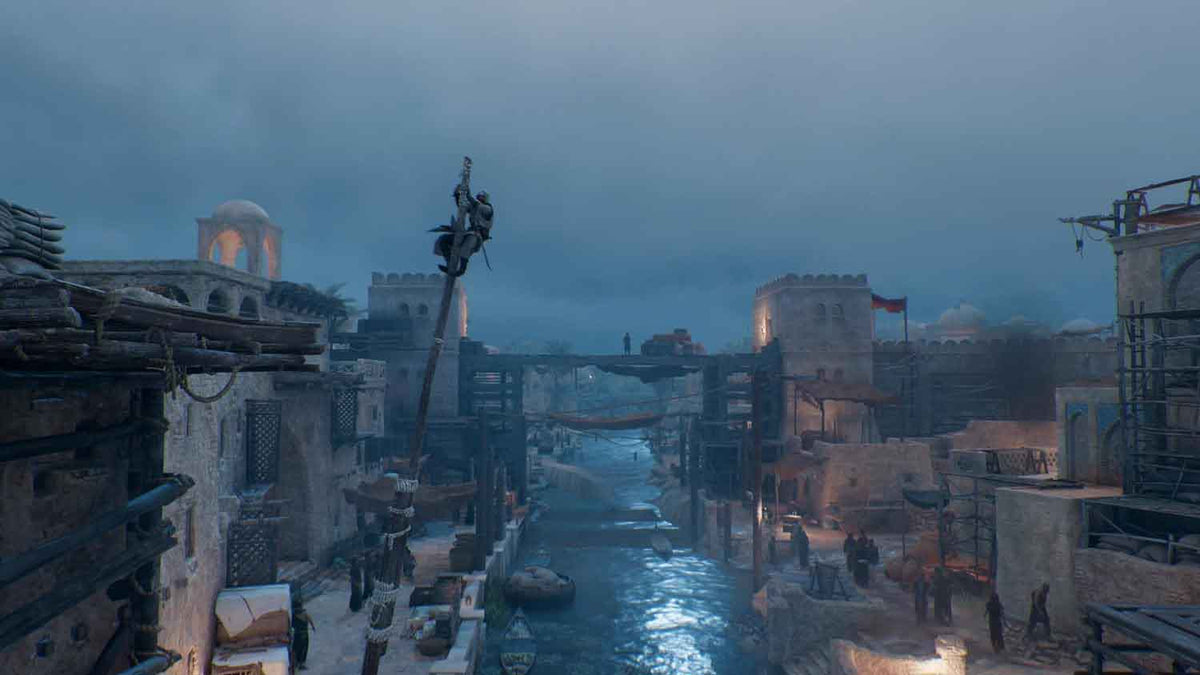 Video game screenshot showing a foggy, blue-toned ancient cityscape with stone buildings and a character climbing a pole, highlighting Assassin's Creed Mirage.